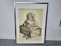 Framed surrealist etching of a bound humanoid in a crate with gloves, visible signature and numbering.