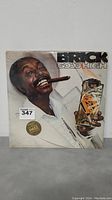 Brick Good High album cover showing man with cigar and drink