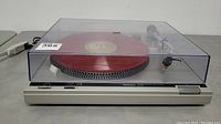Full view of the Technics SL-B2 turntable with closed dust cover showing red platter mat.