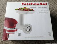 Front of boxed KitchenAid Food Grinder attachment showing product image and branding
