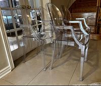 Three chairs seen from front-left angle showing overall appearance and set count