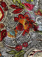 Close-up views of the comforter showing the detailed floral modern pattern with bold colors and black line accents on cream fabric.