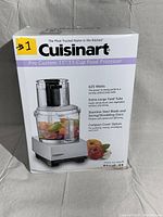 Front box view of Cuisinart Pro Custom 11 food processor in white, showing product image and features (625 Watts, Extra-Large Feed Tube, Stainless Steel Blades)