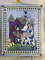 Full view of the farm animal artwork with striped and checkered border and button decoration in top corners