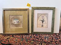 View of both framed prints together showing the teacup design on left and flower design on right.