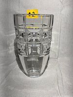 Front view of clear Rosenthal German crystal vase with distinct grid pattern on upper portion and smooth base.