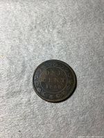 Reverse side showing 'ONE CENT 1859' with wreath design.