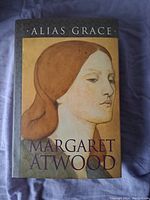 Front cover of Alias Grace hardcover book by Margaret Atwood showing the book title, author, and cover art.