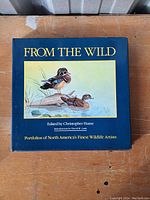 Front cover of 'From The Wild' book showing title, editor, introduction, and duck artwork.