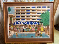 Full view of the framed lithograph showing a lively pool scene with colorful characters and umbrellas.