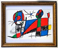 Front view of framed lithograph showing gold wood frame, white mat and abstract design