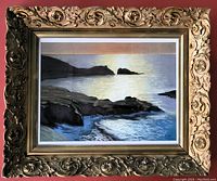 Original pastel seascape painting with rocky shoreline and sunlit water, framed in ornate antique solid wood frame with matting under plexiglass, shown in full front view against a red background.