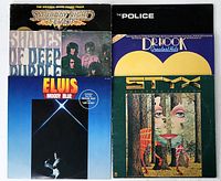 Six vinyl rock and disco records in their covers showing titles and artists.