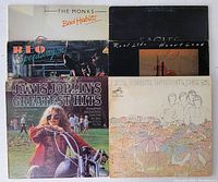 Photo displaying all six vinyl record covers together showing artist and album titles for identification.