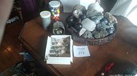 Overall lot showing specimen box, jars of marbles, and loose rocks on table