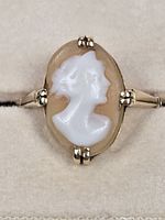 Front view of ring showing oval shell cameo profile