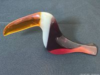 Left-side view of entire figurine showing overall shape and color gradient.