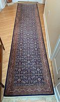 Full view of Keshan carpet runner laid on hardwood floor