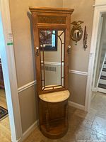 Front view of full hall tree showing mirror, marble shelf and base shelf