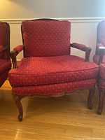 Front view of the wooden framed custom lounge chair with red patterned upholstery showing seat and back cushion.