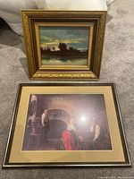 Two framed pieces: the oil painting above with a golden ornate frame and the print below with a dark simple frame.