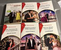 Photo showing six Harlequin romance books with covers visible and readable titles.