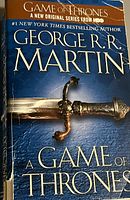 Front cover of the hardcover book 'A Game of Thrones' by George R. R. Martin showing title, author, and HBO series mention.