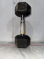 Front view of 30 lb hex dumbbell showing weight marking and handle with labels.