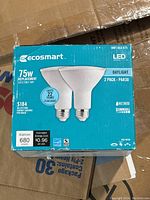 Box showing Ecosmart 75W LED bulb two pack with daylight color temperature and energy info