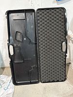 Open Beretta gun case showing interior molded compartments and foam padding