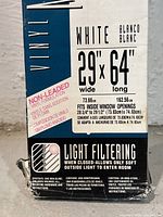 Packaging label showing vinyl window blind dimensions 29x64 inches, light filtering feature, and non-leaded vinyl formulation.
