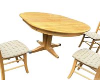 Round wood dining table shown fully assembled with pedestal base and three chairs positioned around it (chairs not included in sale).