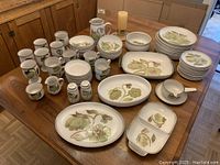 Full spread of all pieces on table