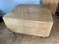 Top view of the solid maple table with both leaves folded down.