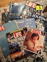 Photo showing a stack of vintage magazines including Life issues from 1982, 1992, 1994, and special editions, plus Look and Post magazines.
