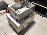 Warmer unit positioned on original box