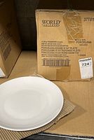 Box showing product labeling and branding: World Tableware porcelain round plates, 11 1/4 inch size, box of 12.