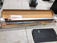 Full view of food warmer in original box with protective foam