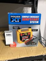 Box image of Power XT Compact Emergency Jump Start System showing front packaging and product name.