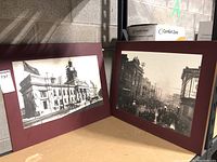 Two historical black and white Kingston photographs mounted on plaque boards, showing architectural and street scenes from Kingston. Both show age and wear.