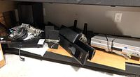 Wide view of shelf containing LG home theatre system components and Samsung DVD-VHS player