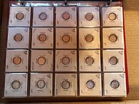 First page: 25 Canadian 5c coins in white cardboard flips labeled by year.