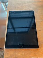 Front view with display off showing smudges and overall bezel condition