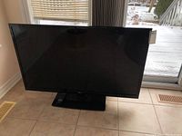 Front view of LG 47-inch television showing screen and stand.