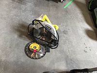Ryobi circular saw with separate yellow label blade and large blade visible