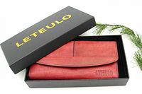 Red leather wallet inside a black LETEULO box with yellow lettering, showcasing the wallet's overall presentation.