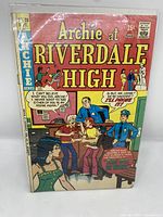 Front cover of Archie at Riverdale High #28 comic book showing main characters in a humorous scene with police officers and a woman in the foreground, with title and issue details visible.