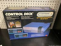Front of original NES Control Deck box showing branding and graphics