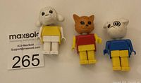 Front view of 3 LEGO Fabuland figures: Lamb, Cat, and Bulldog.