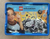 Box lid of LEGO Education set 9648 showing assembled gears and wheels with child on label